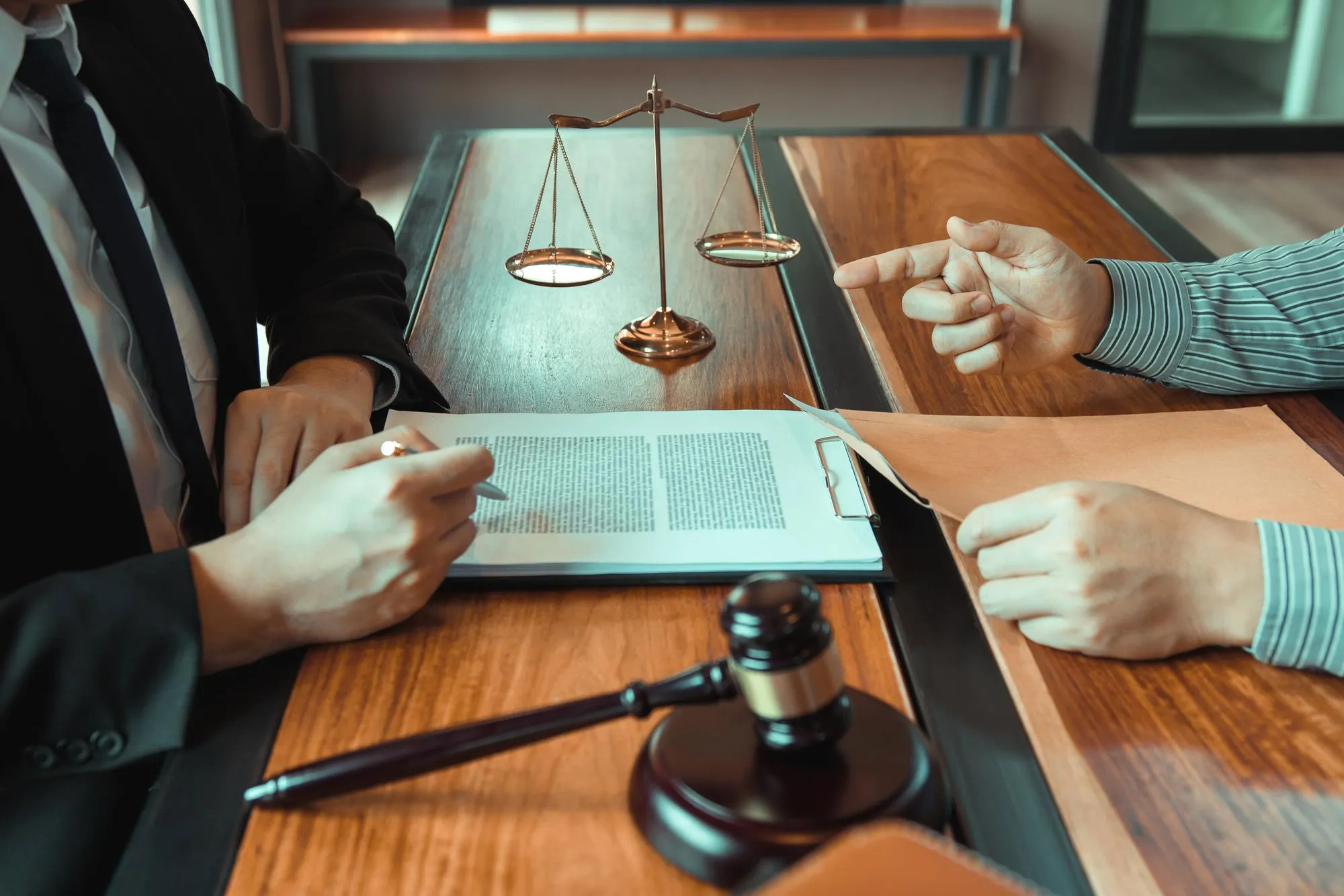 Lawyers advising a client on corporate and financial legal matters.