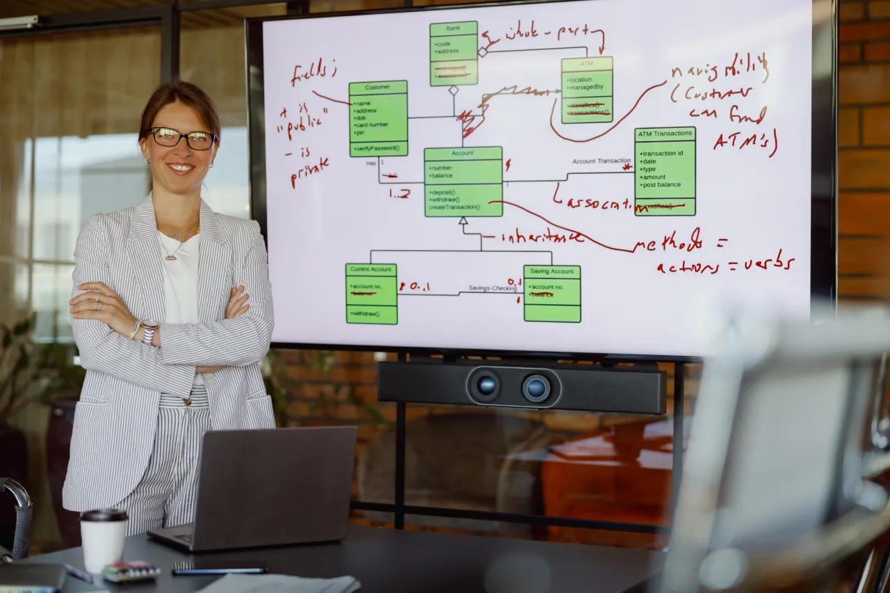 Businesswoman analyzing financial and risk data, representing catastrophe modeling expertise
